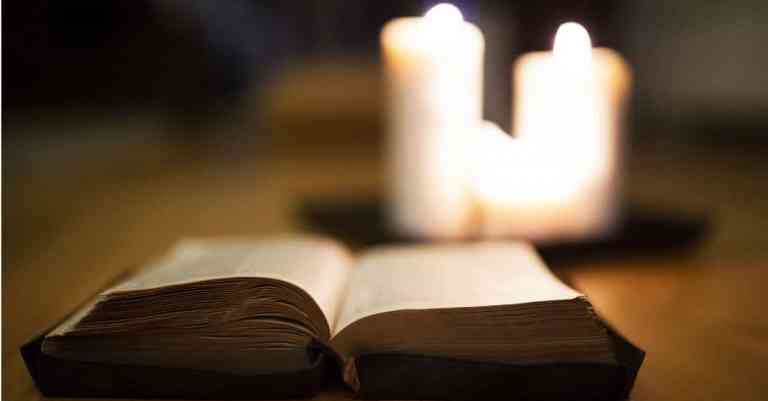 1200x628-graphicstock-close-up-of-an-old-bible-laid-on-wooden-floor-burning-candles-next-to-it